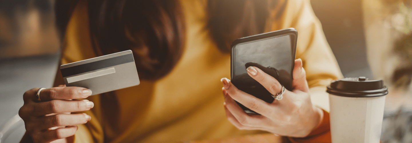 Woman online shopping with a credit card