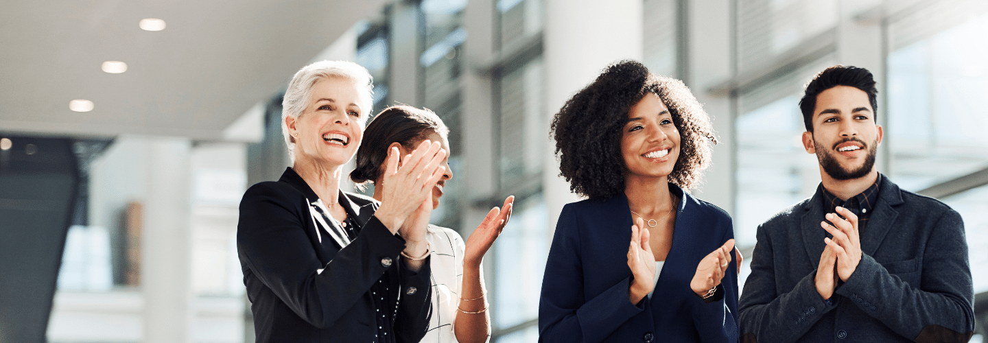 Professionals clapping with smiles | Rea