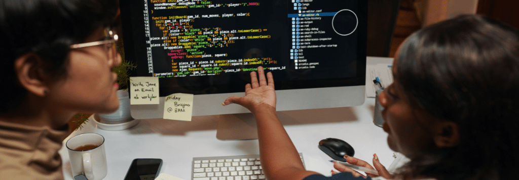 Two Women Discussing Cyber program