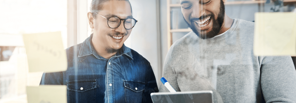 Two Men Smiling Working together